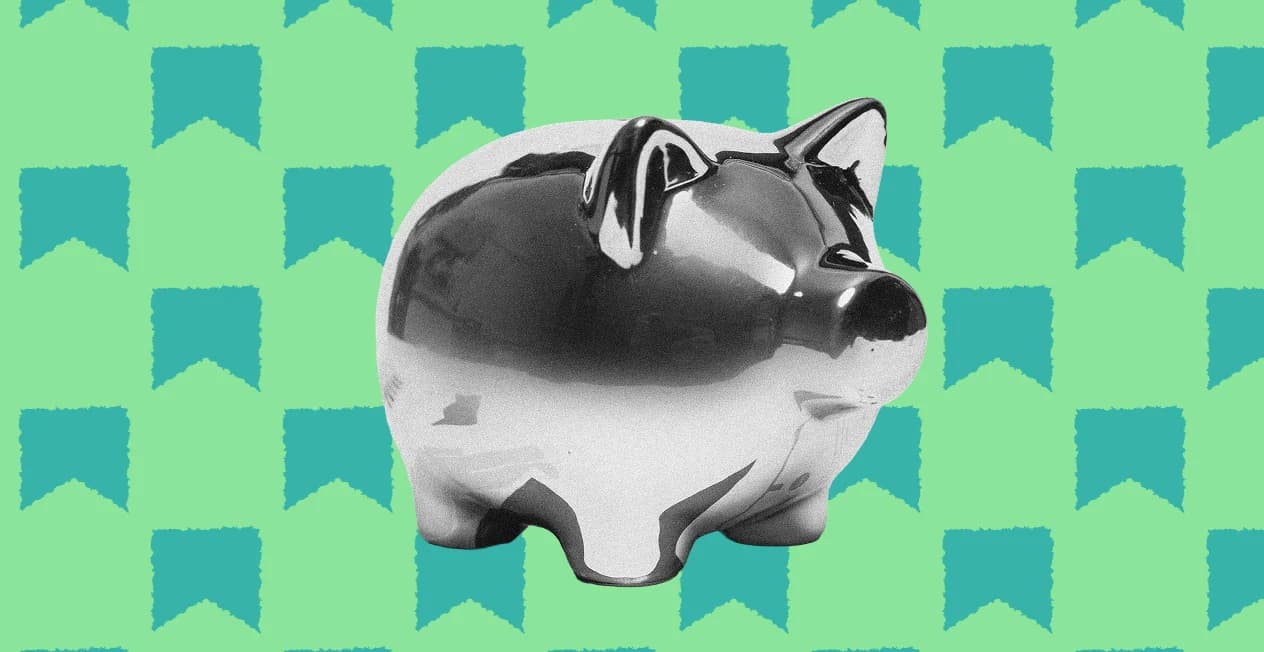 A silver piggy bank on a green banner pattern