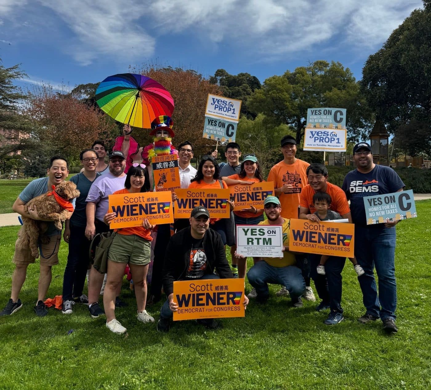 Chapter members and neighbors with campaign signs at a park rally