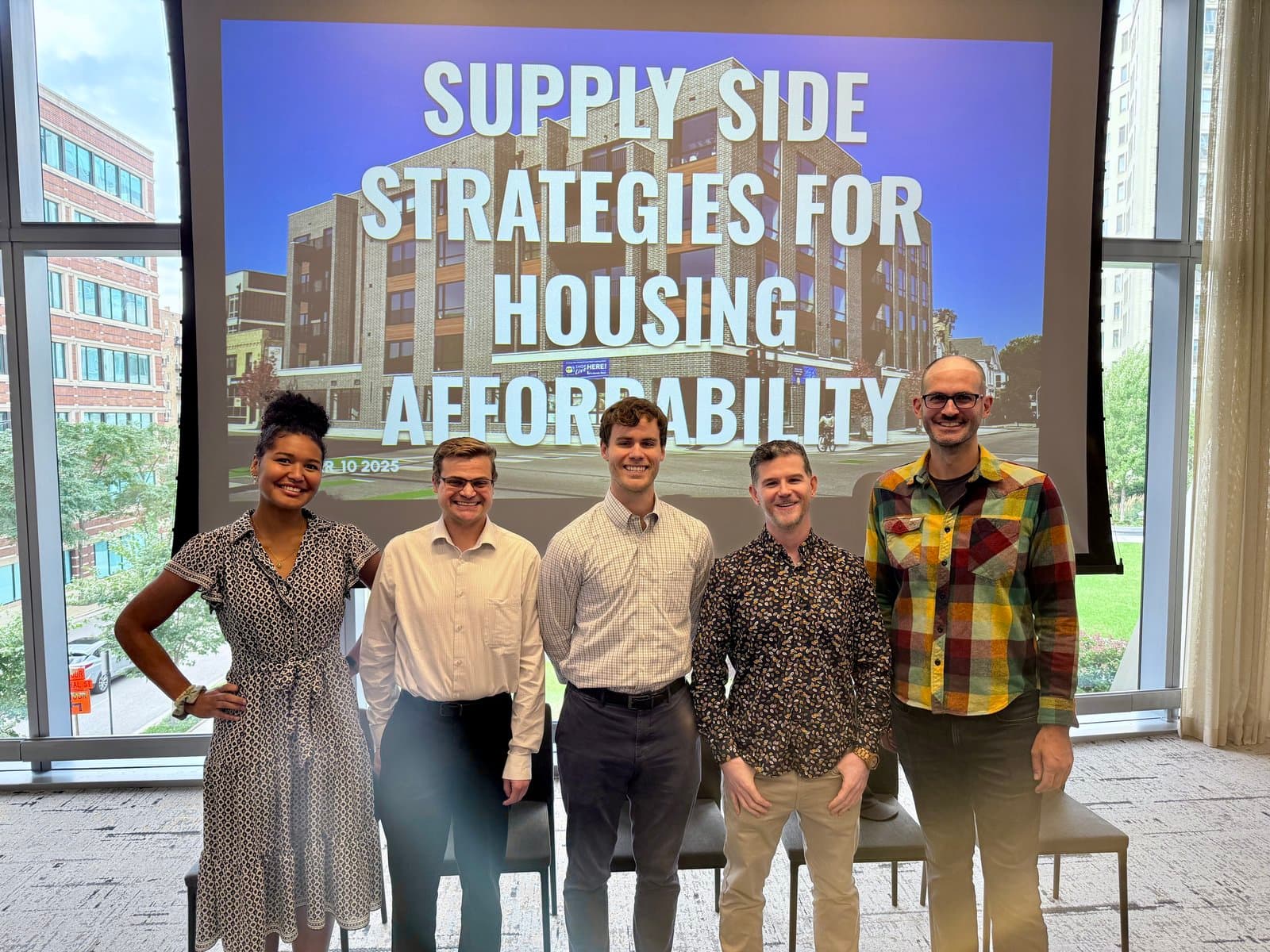 Abundant Housing Illinois panelists in front of a slide titled Supply side strategies for housing affordability