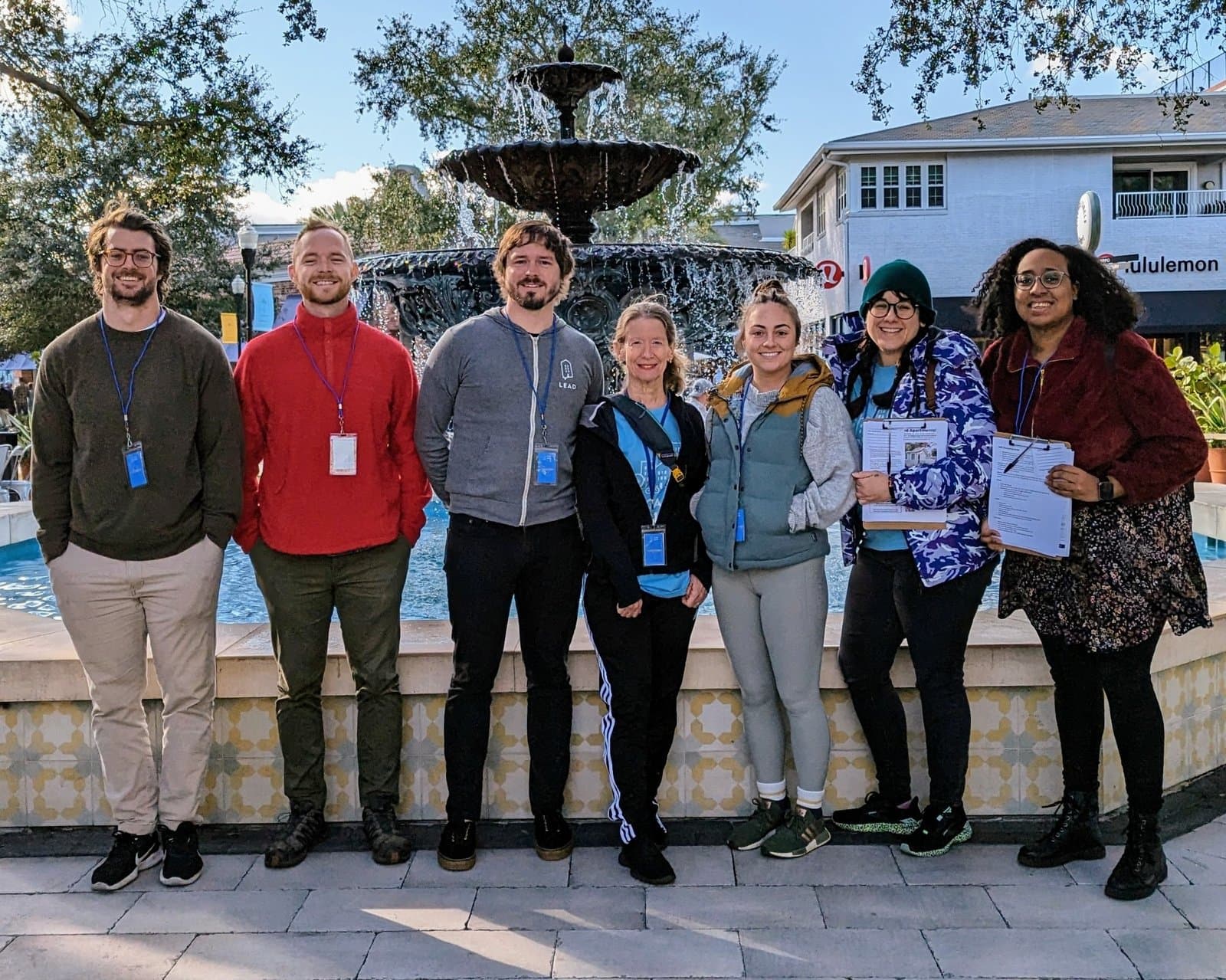 YIMBY Tampa volunteers with clipboards in front of a fountain before a canvass