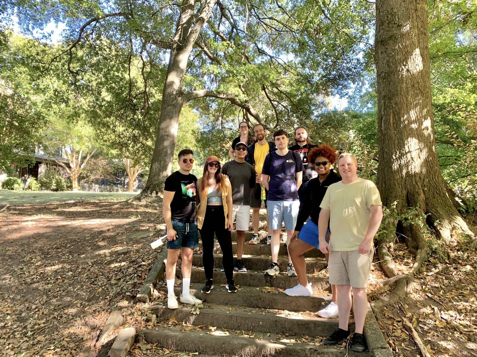 Chapter members gathered on a shaded park stairway
